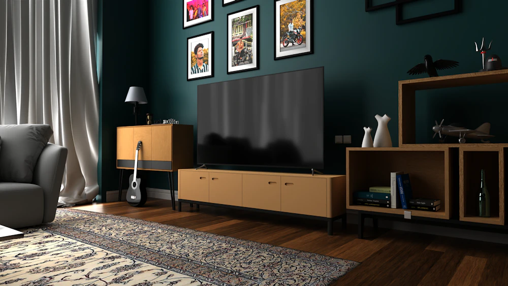 Black flat-screen TV on a brown wooden TV rack, an example of a TV unit in an Abu Dhabi living room