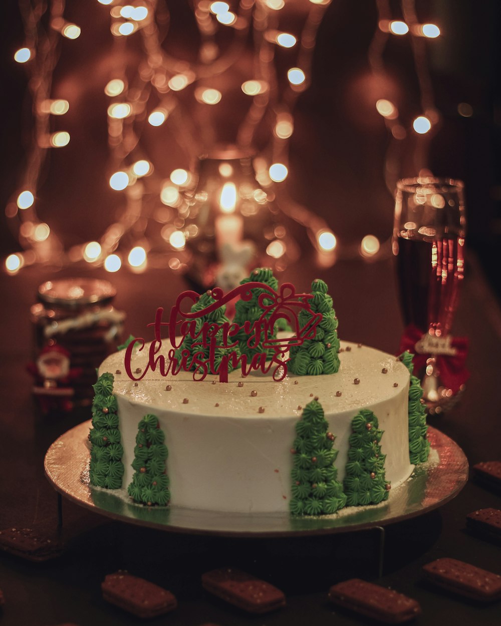 white cake with red and green toppings on table