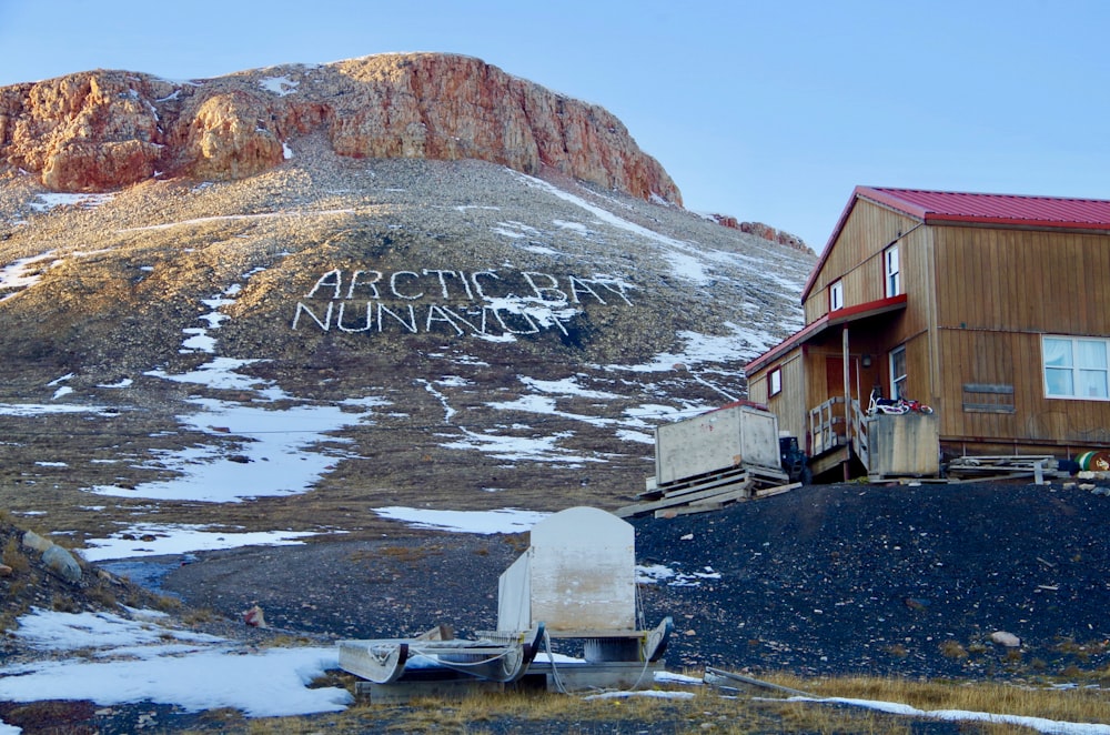 brown and white house near mountain during daytime