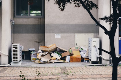 brown cardboard boxes on gray concrete floor