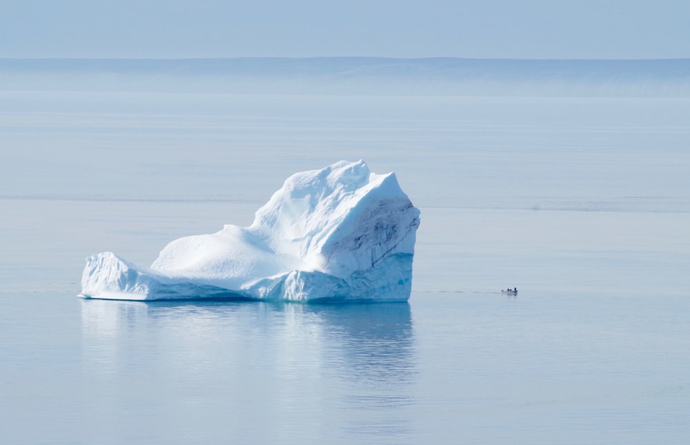 white ice on body of water during daytime