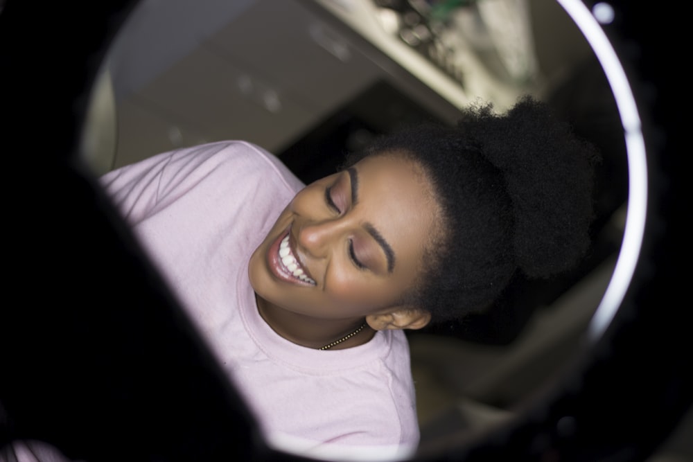 smiling girl in white crew neck shirt