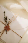 An artist sketching a custom wedding invitation design on elegant textured paper.