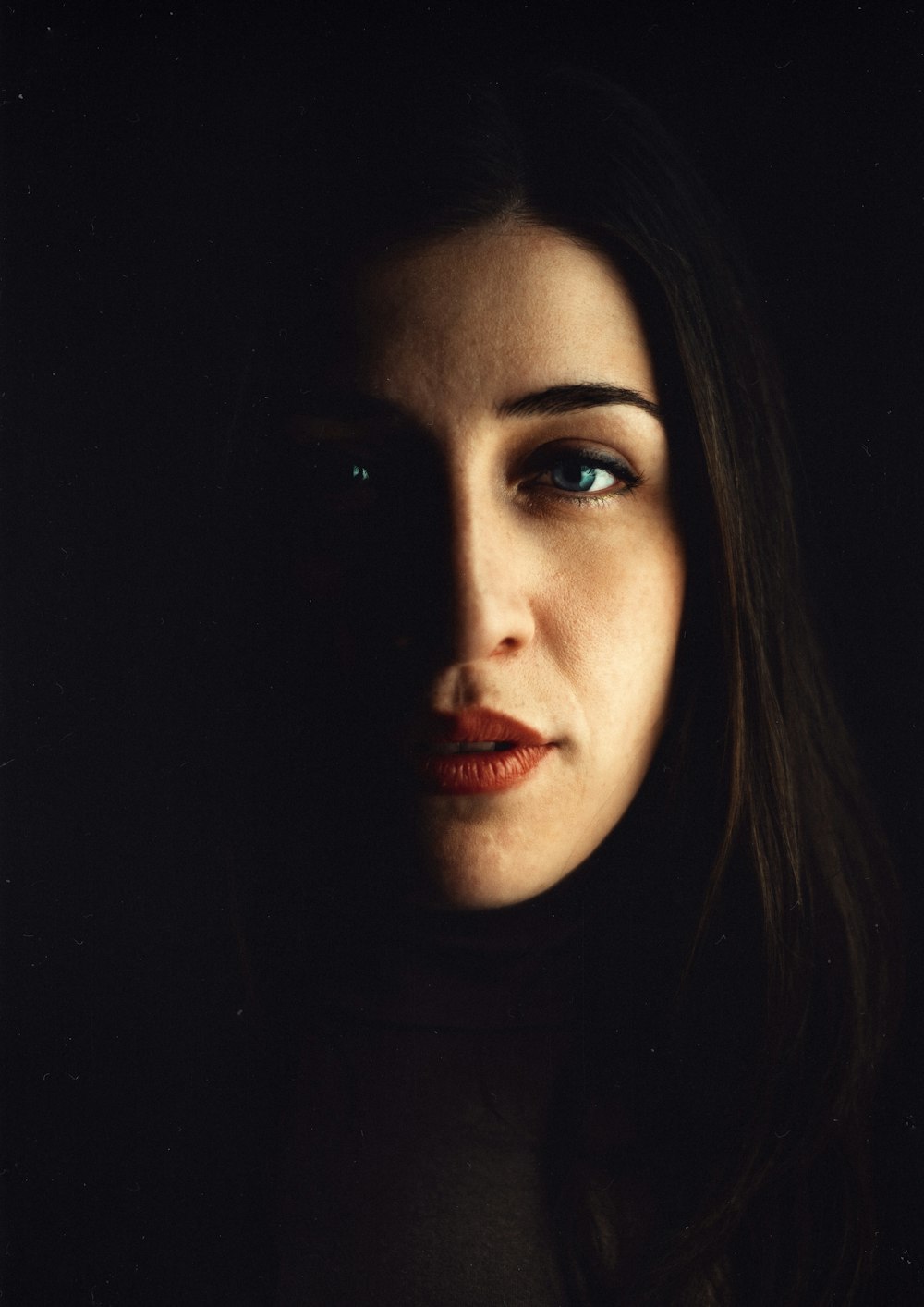 woman with black hair and red lipstick