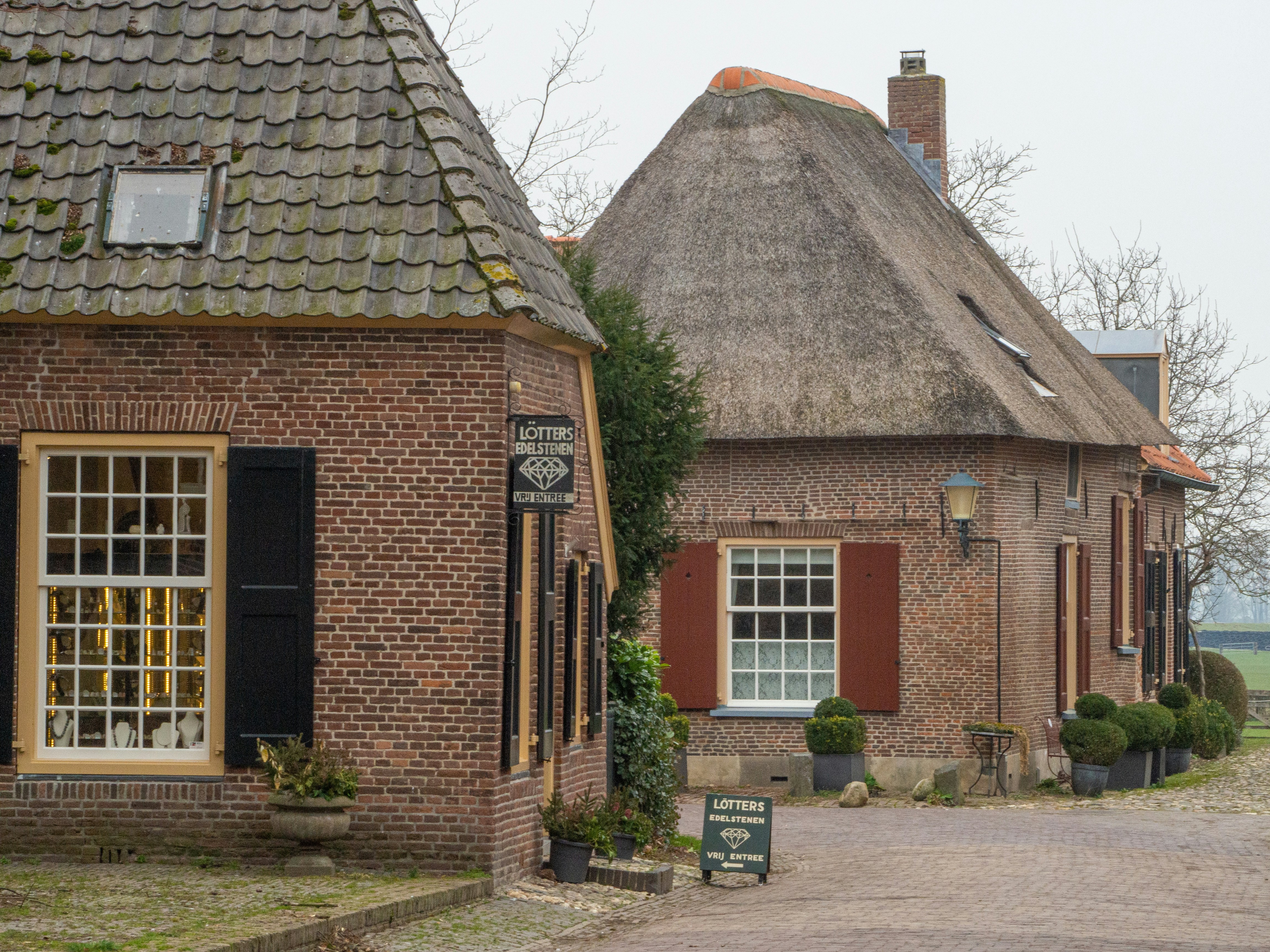 brown brick house with white wooden door