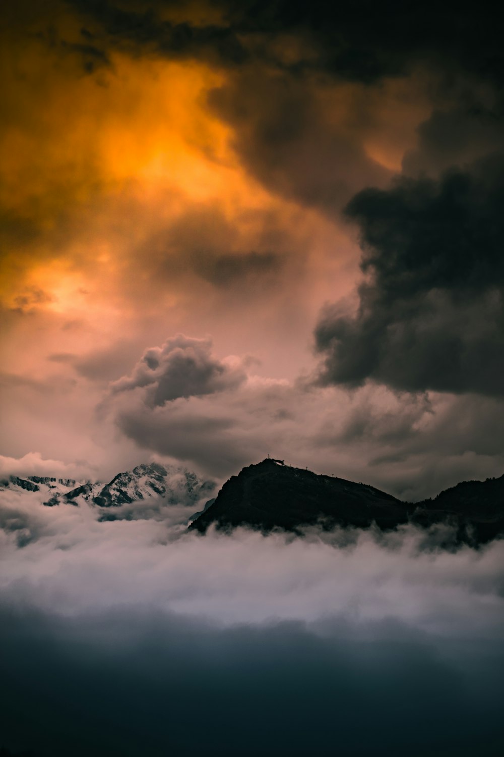 black mountain under cloudy sky during daytime