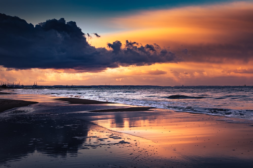 body of water during sunset