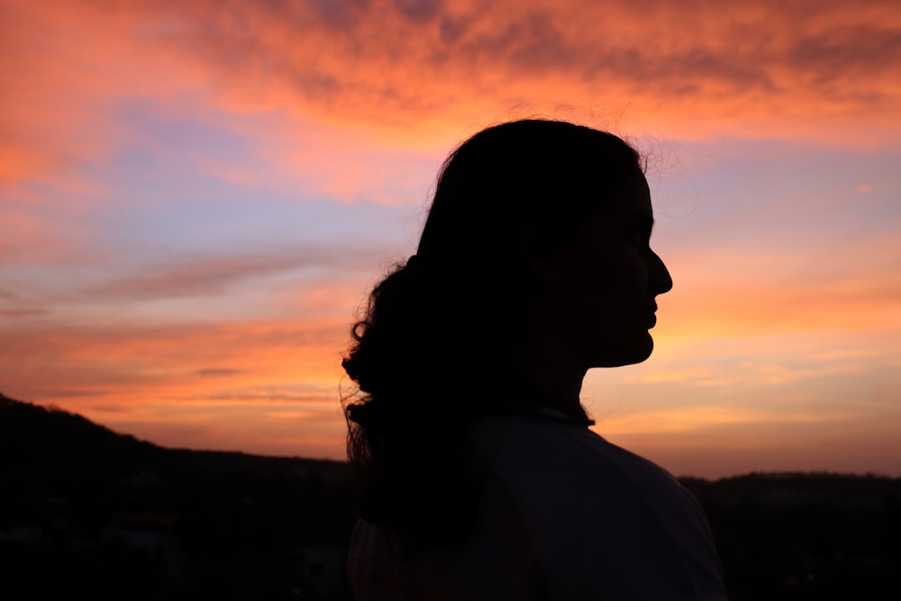 silhouette of woman during sunset