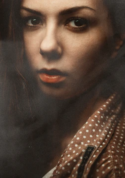 Close-up of a thoughtful actress Kajal Urmila Jain in character, eyes filled with emotion.