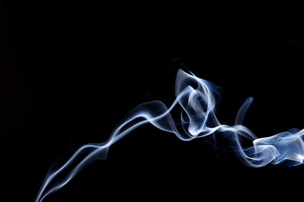 white smoke on black background