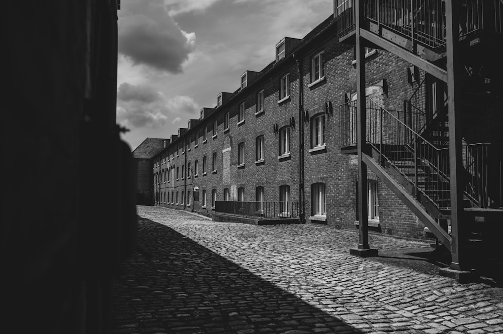 grayscale photo of brick building