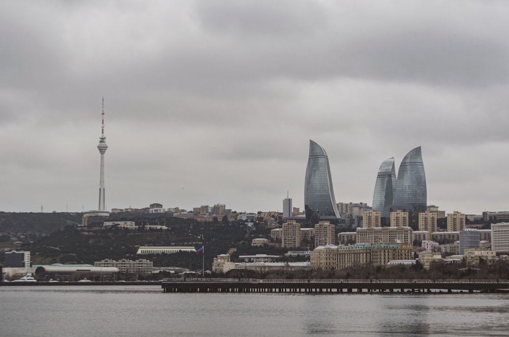 city skyline under gray cloudy sky during daytime