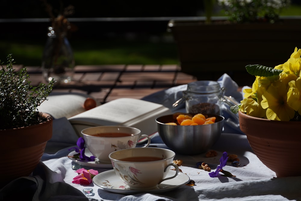 white ceramic teacup on white ceramic saucer