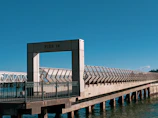 Finished pier with clean lines and polished surfaces reflecting a clear sky.
