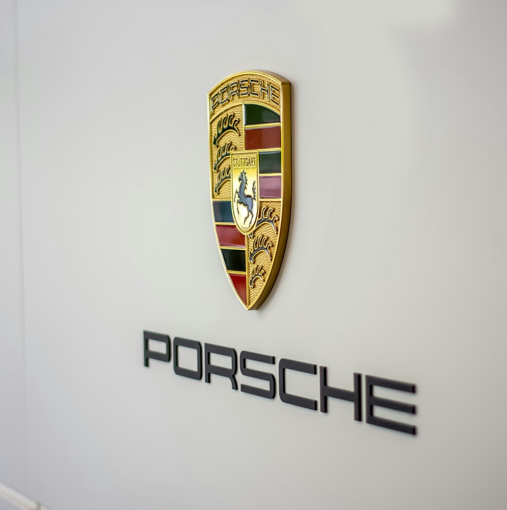 a porsche emblem on the side of a white car