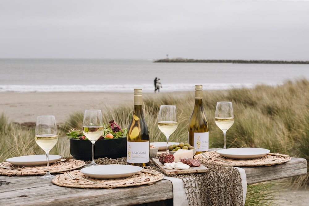 wine bottle and wine glass on table