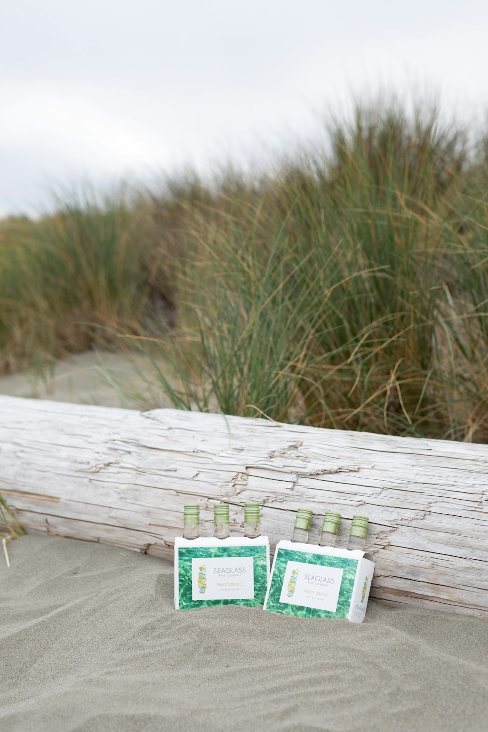 green and white labeled box on wooden plank