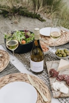 A scenic view of Portugal’s coastline with a picnic setup featuring local delicacies.
