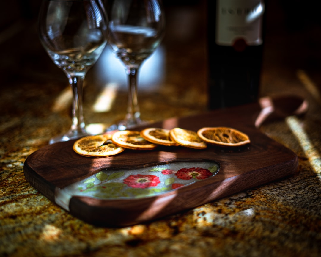 brown wooden board with brown wooden plate and wine glass