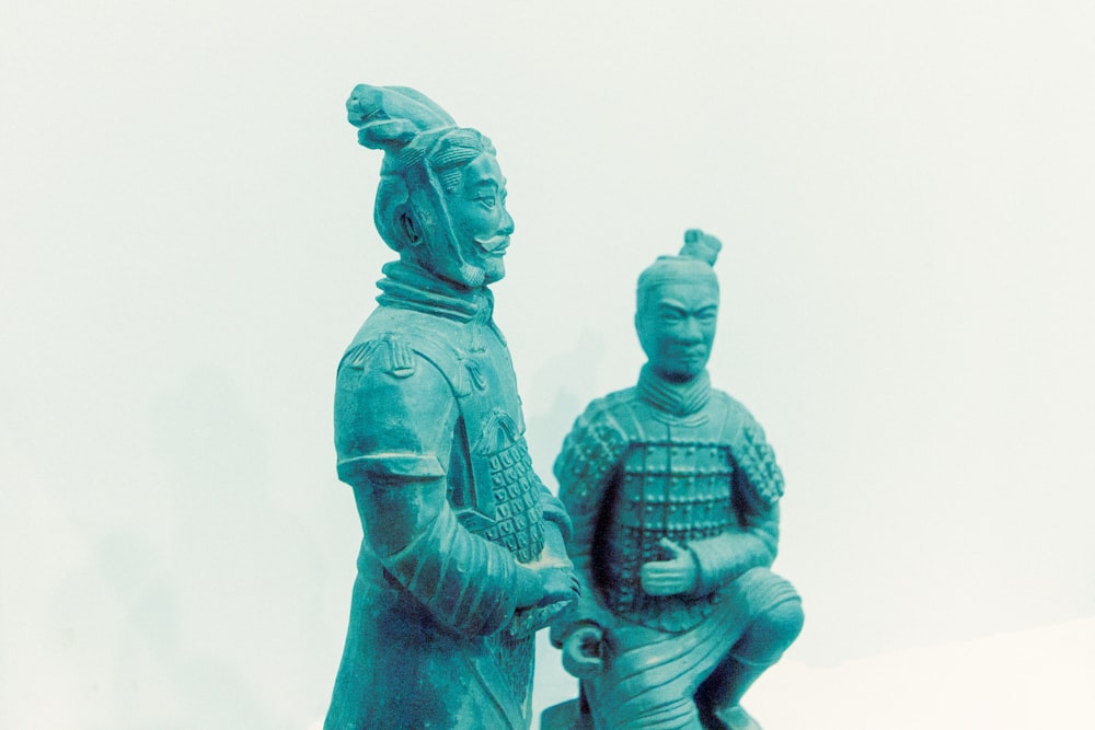 man and woman statue on white background