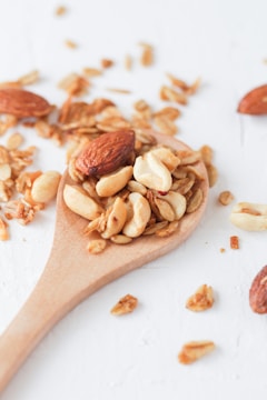 brown wooden spoon with brown and white food