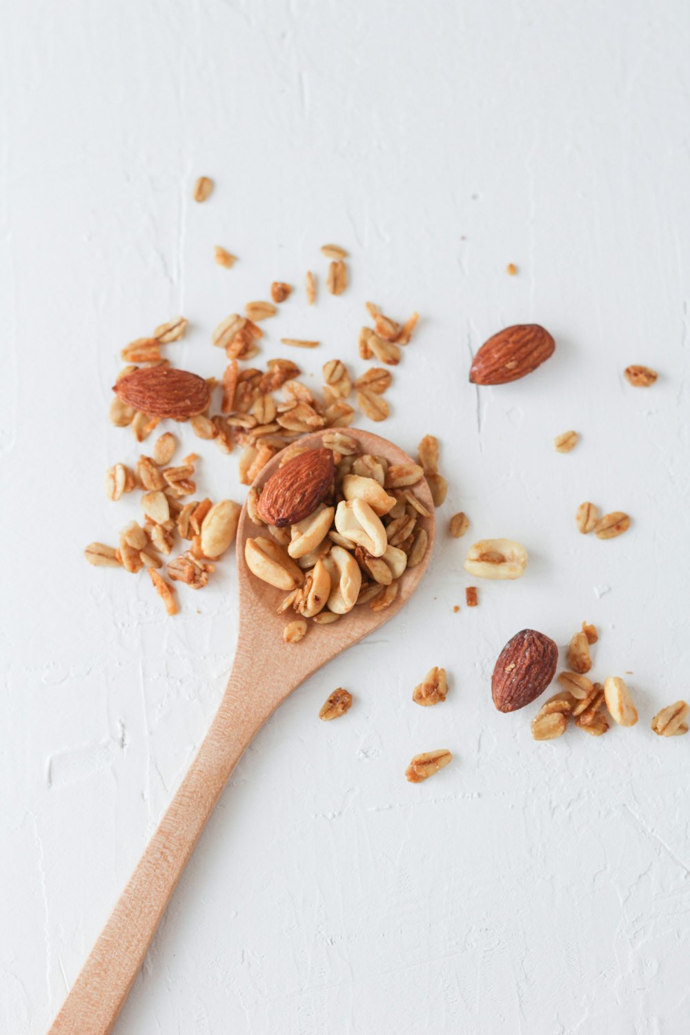 brown wooden spoon with brown and white seeds