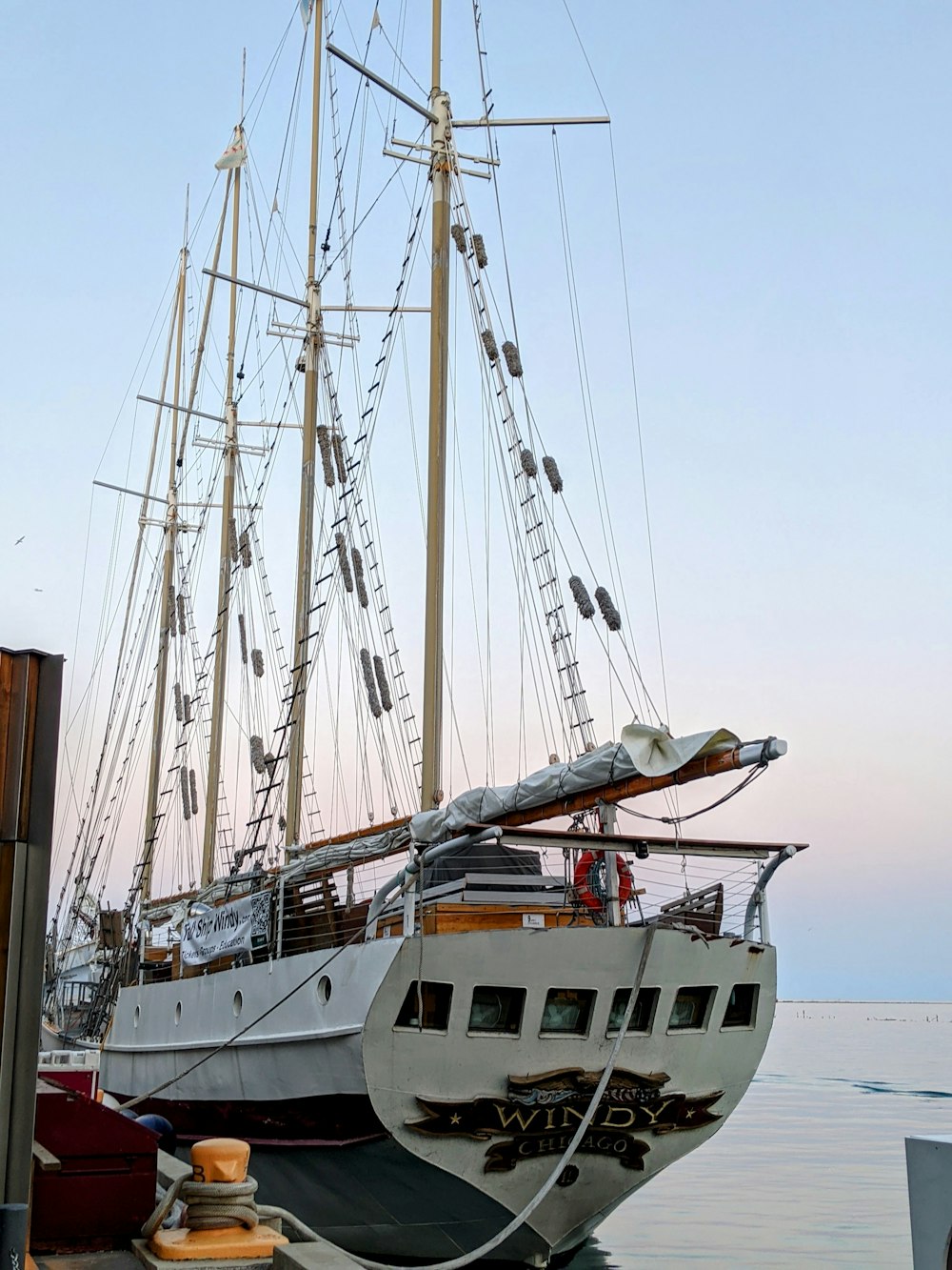 white and red boat on sea during daytime