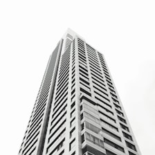 grayscale photo of high rise building