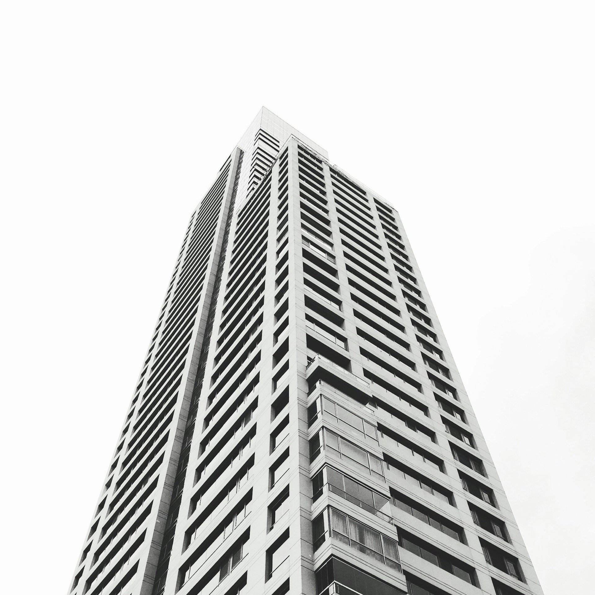 grayscale photo of high rise building