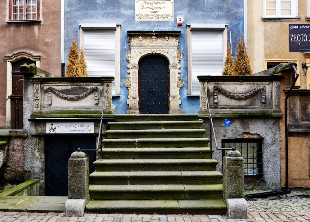 gray concrete staircase with gray metal railings