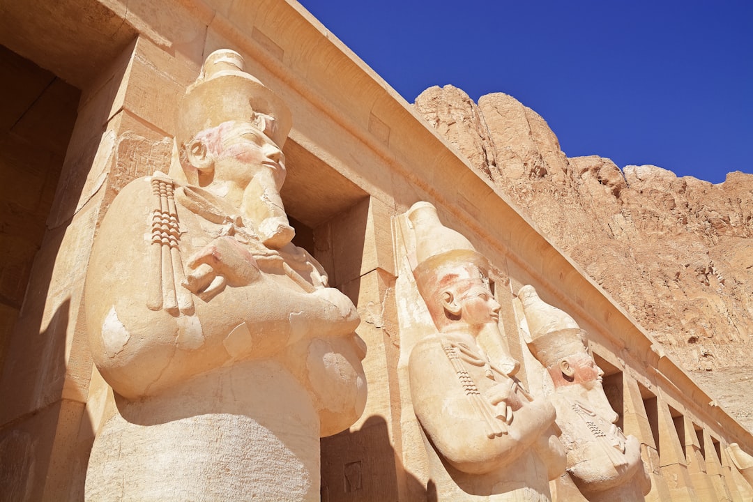 white concrete statue under blue sky during daytime