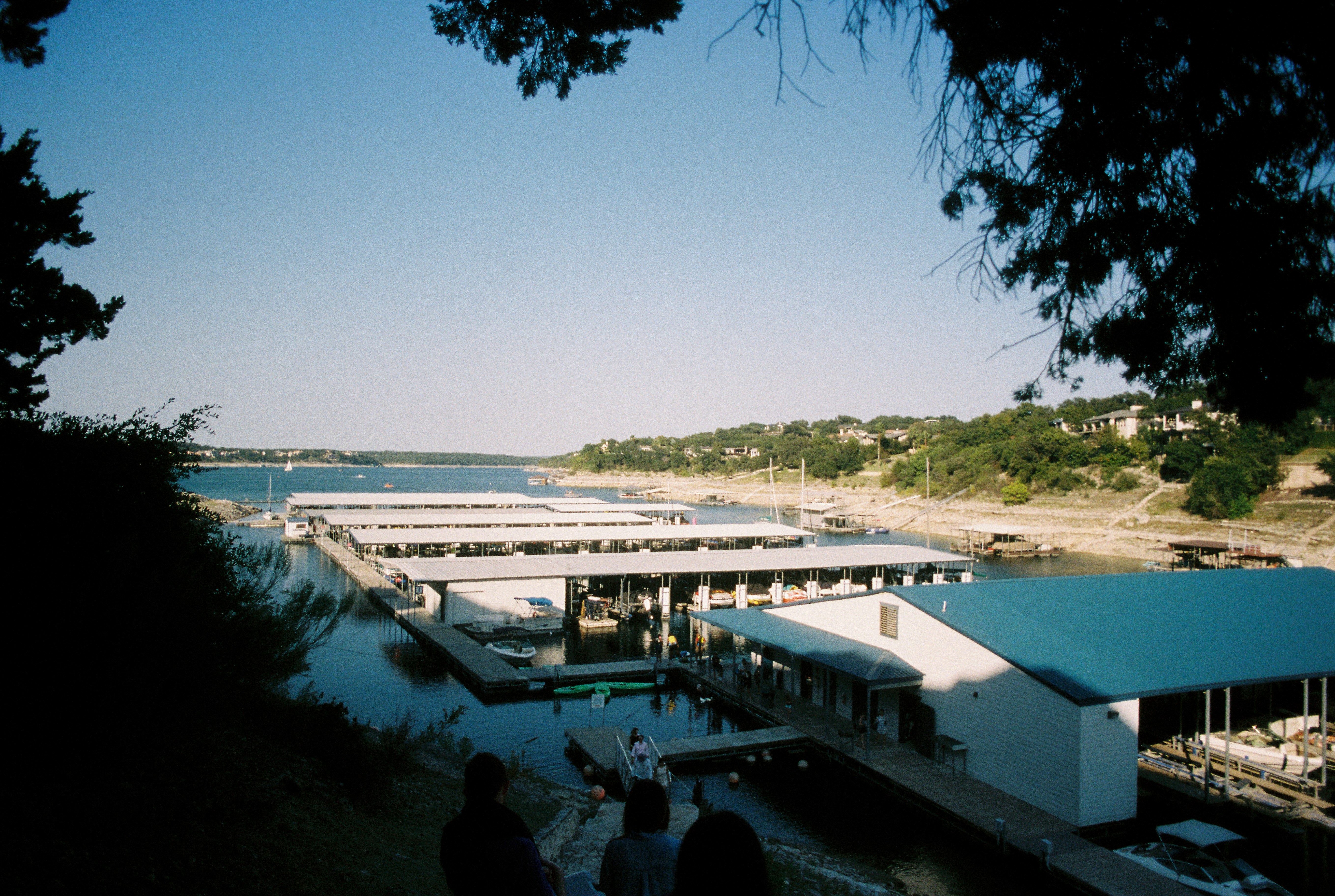 people walking on bridge over river during daytime