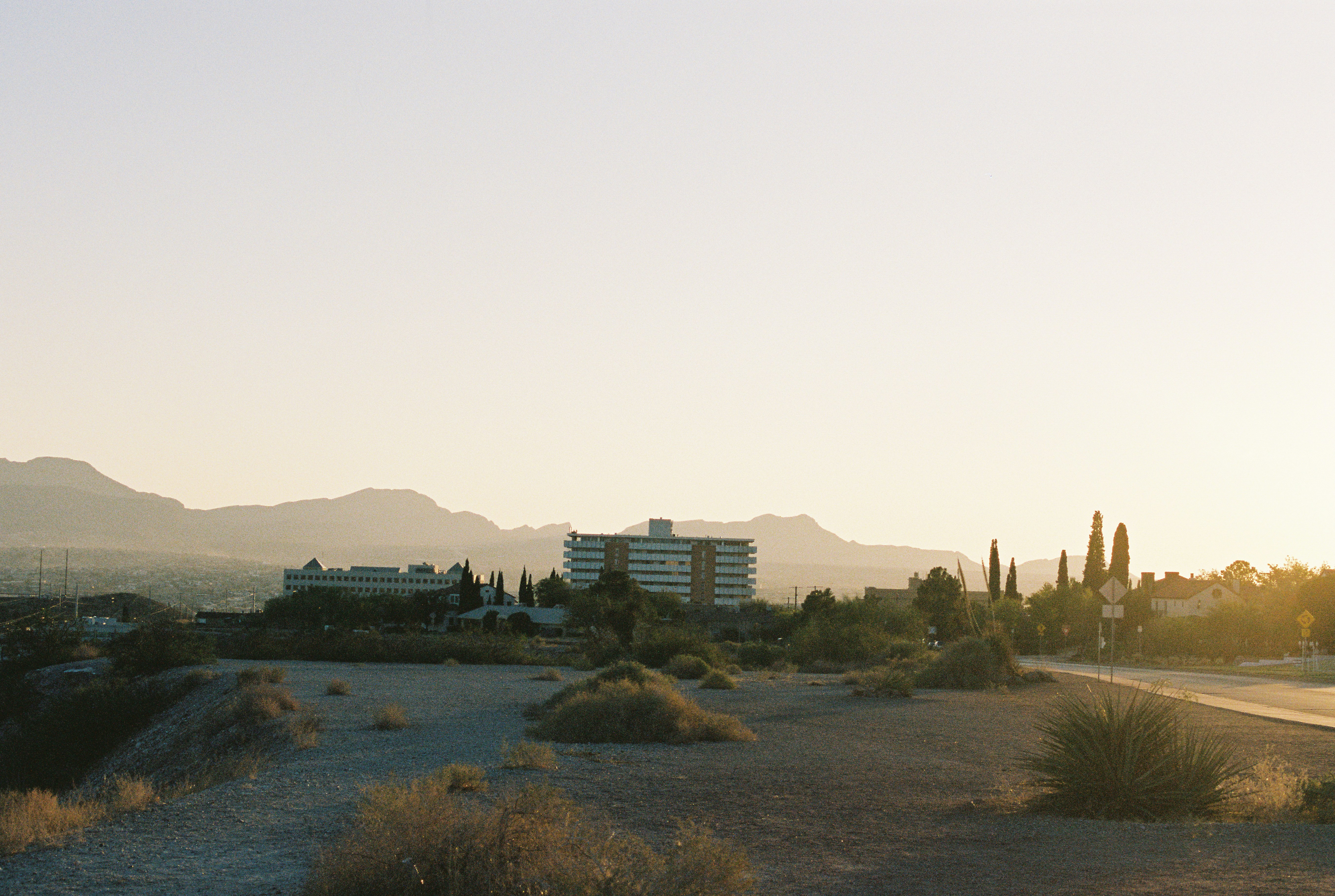 city skyline under white sky during daytime, 
