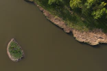 green grass field beside river