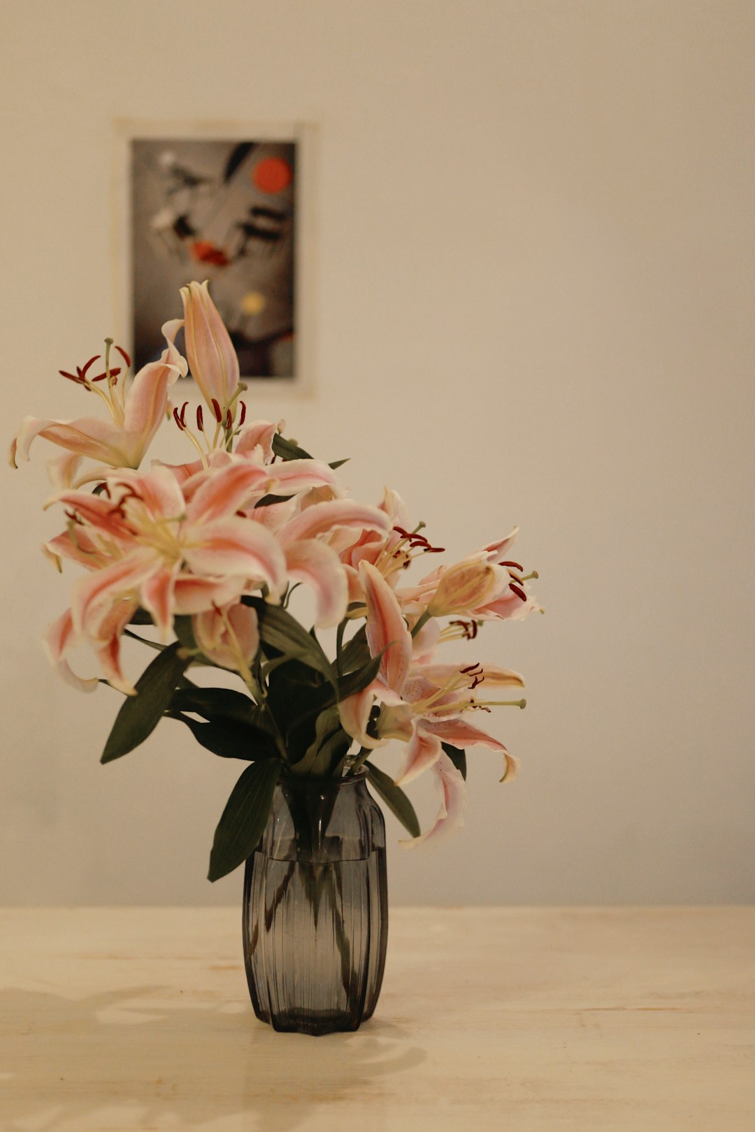 white and pink flowers in clear glass vase