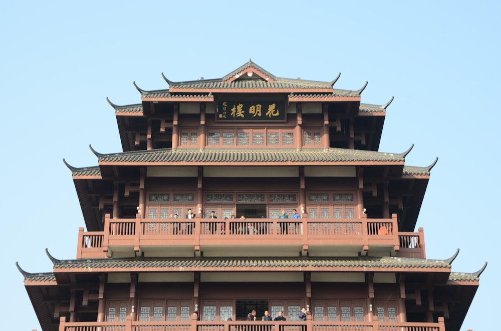 brown and white concrete building under blue sky during daytime