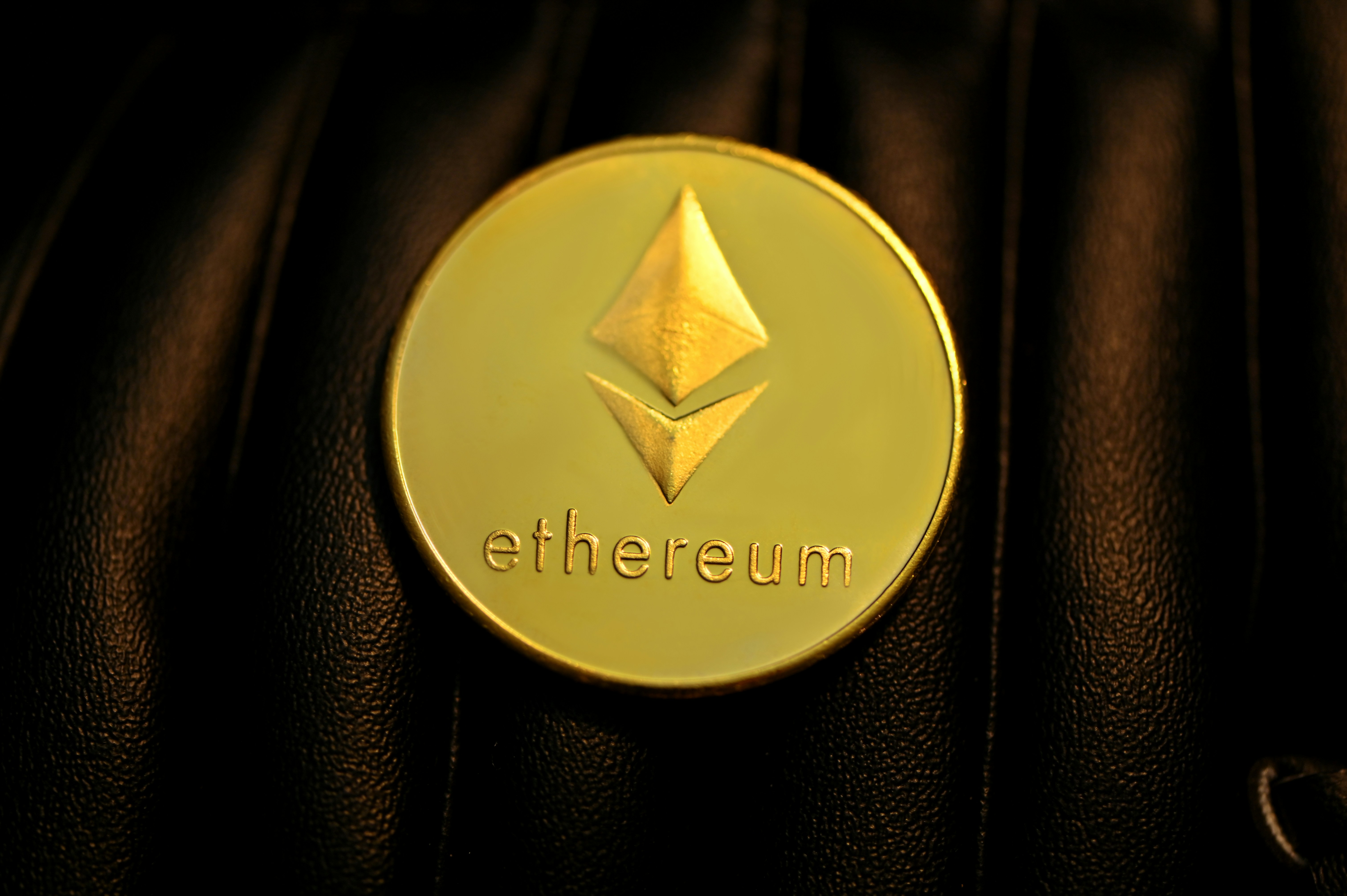 Ethereum on a dark leather surface.