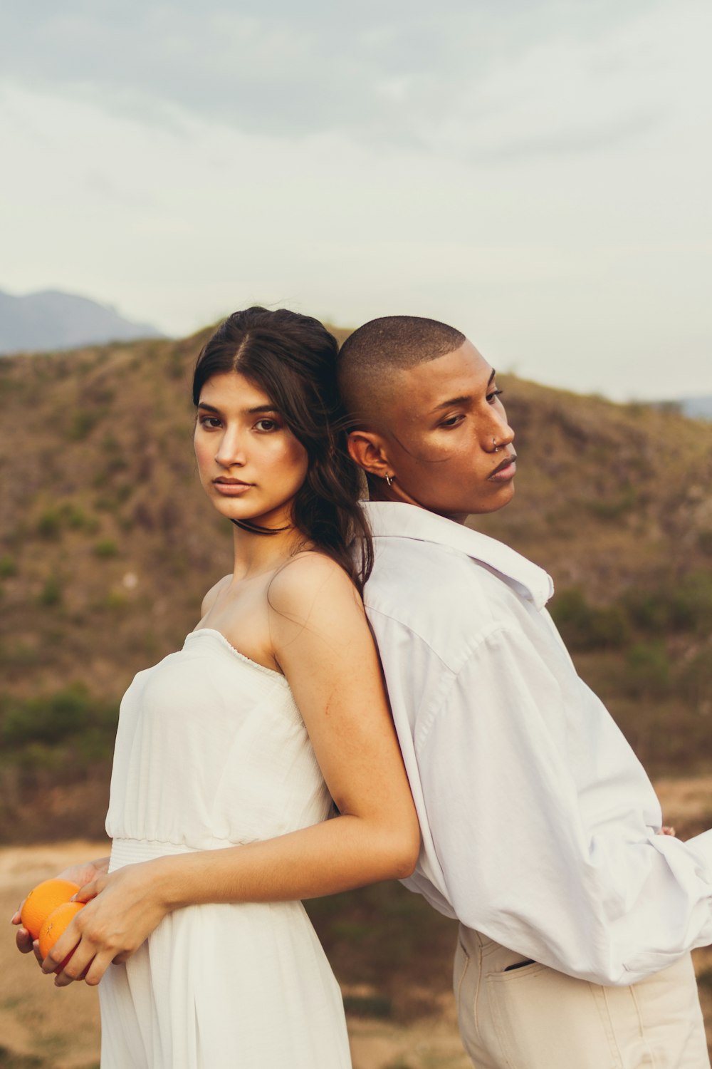 man in white dress shirt beside woman in white dress