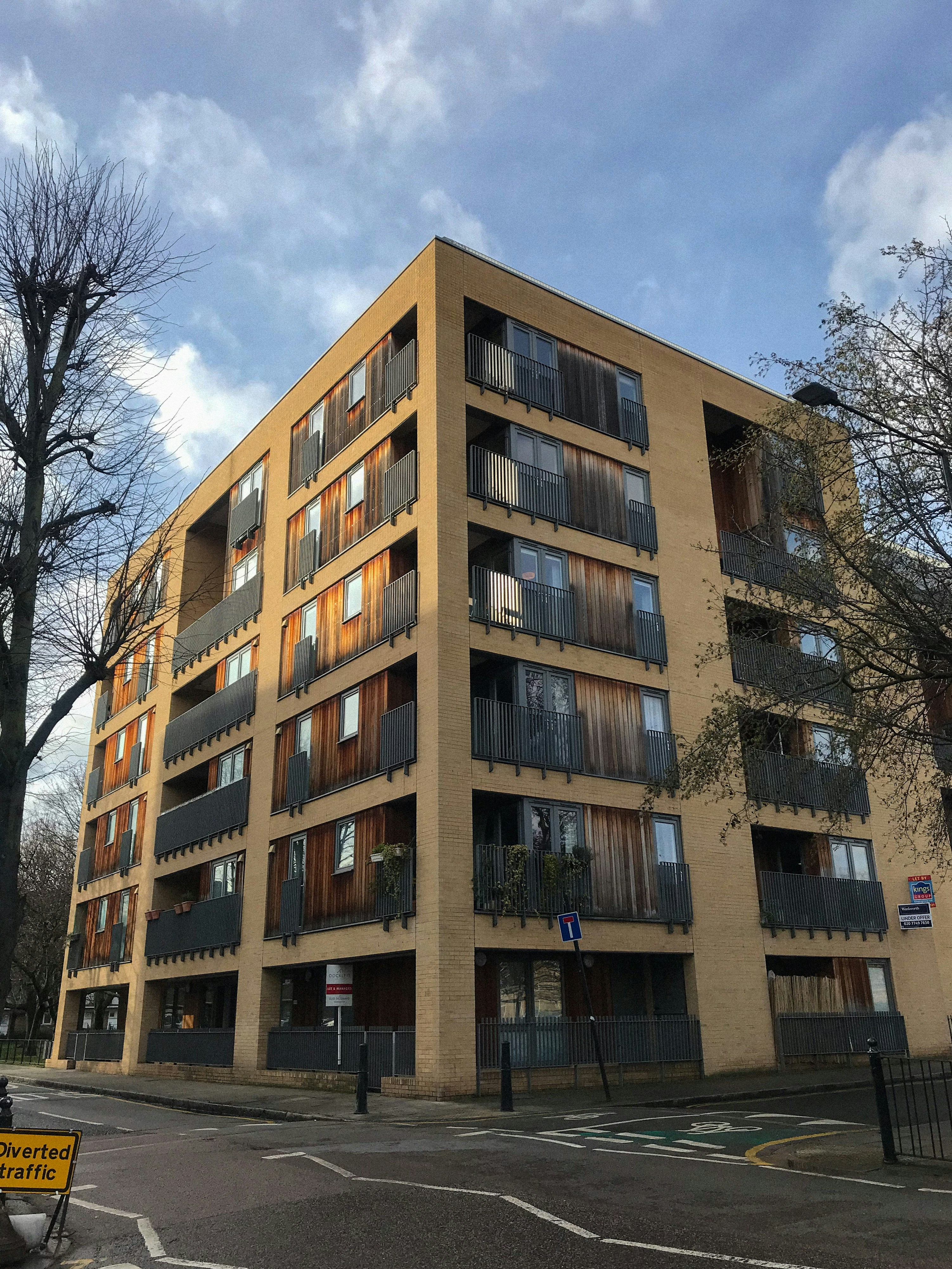 A brown concrete building under blue sky