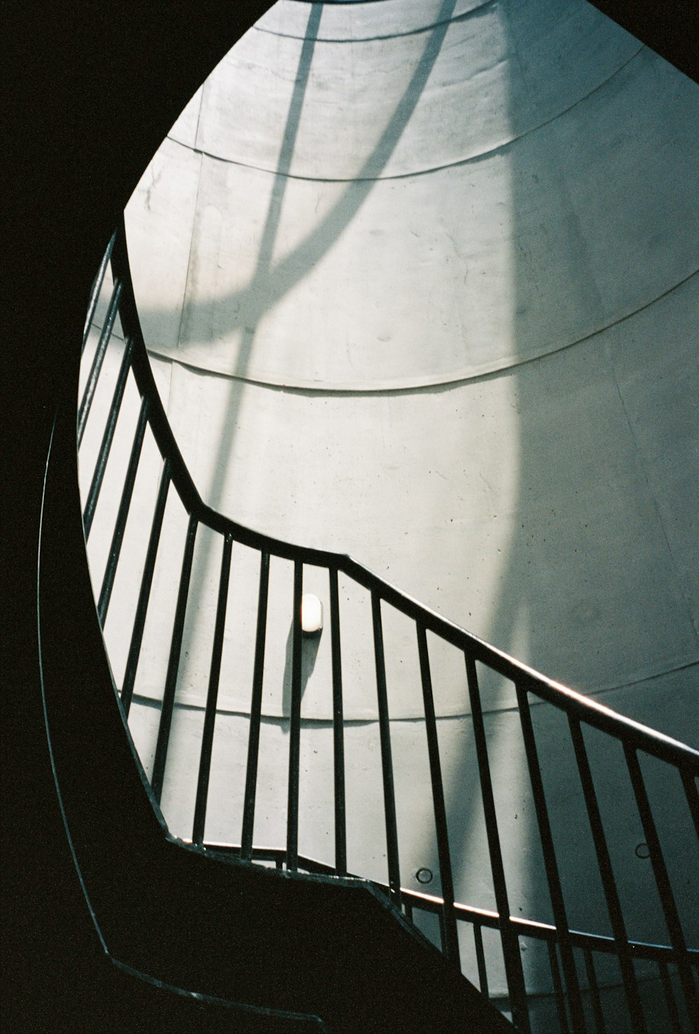 white and brown spiral staircase