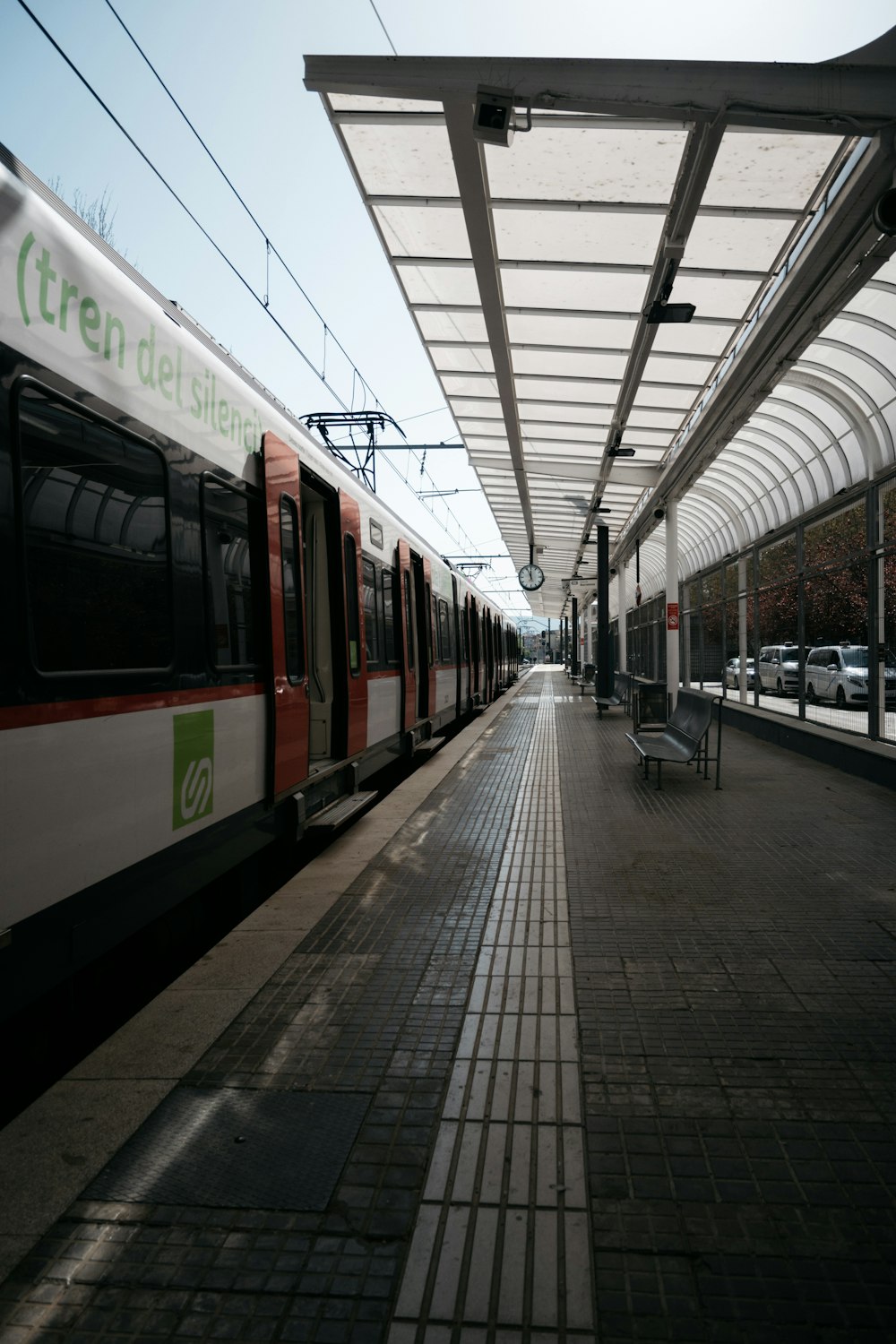 red and white train on train station