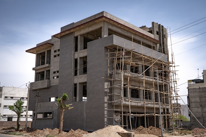 A newly built residential apartment complex under a blue sky, representing high-density RH-36 style development