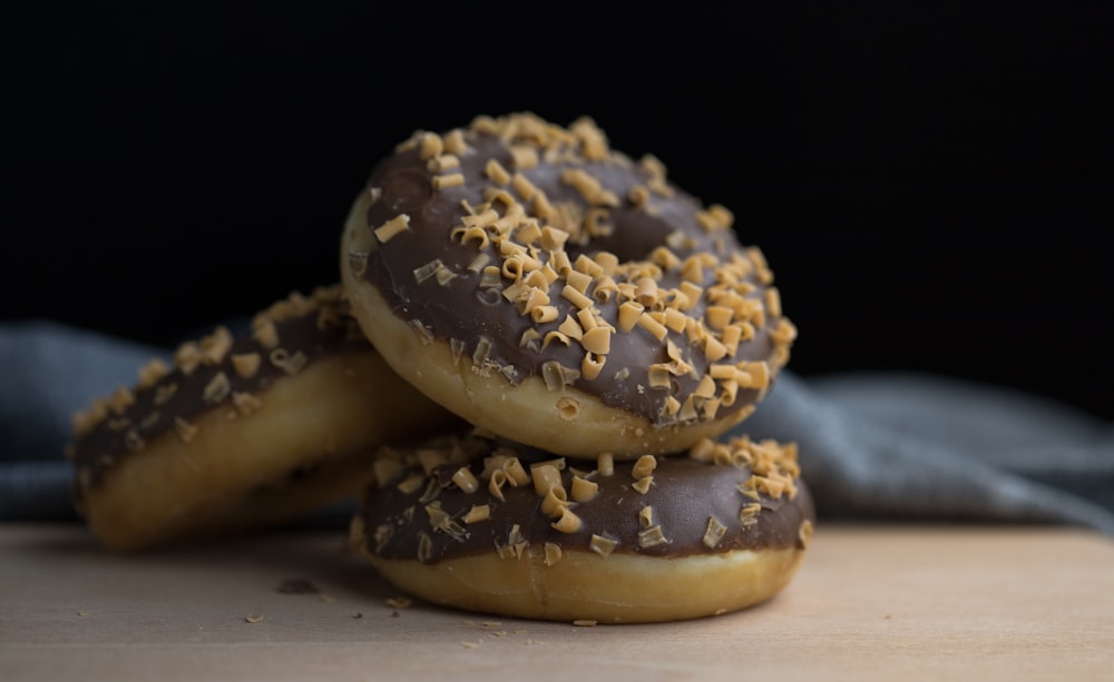 brown and blue donut on white table