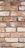 An arrangement of weathered red bricks with visible cracks and a slightly worn texture, set in gray mortar. The bricks are aligned in a uniform manner, showcasing a rustic and aged appearance.