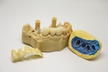 yellow and blue plastic toy