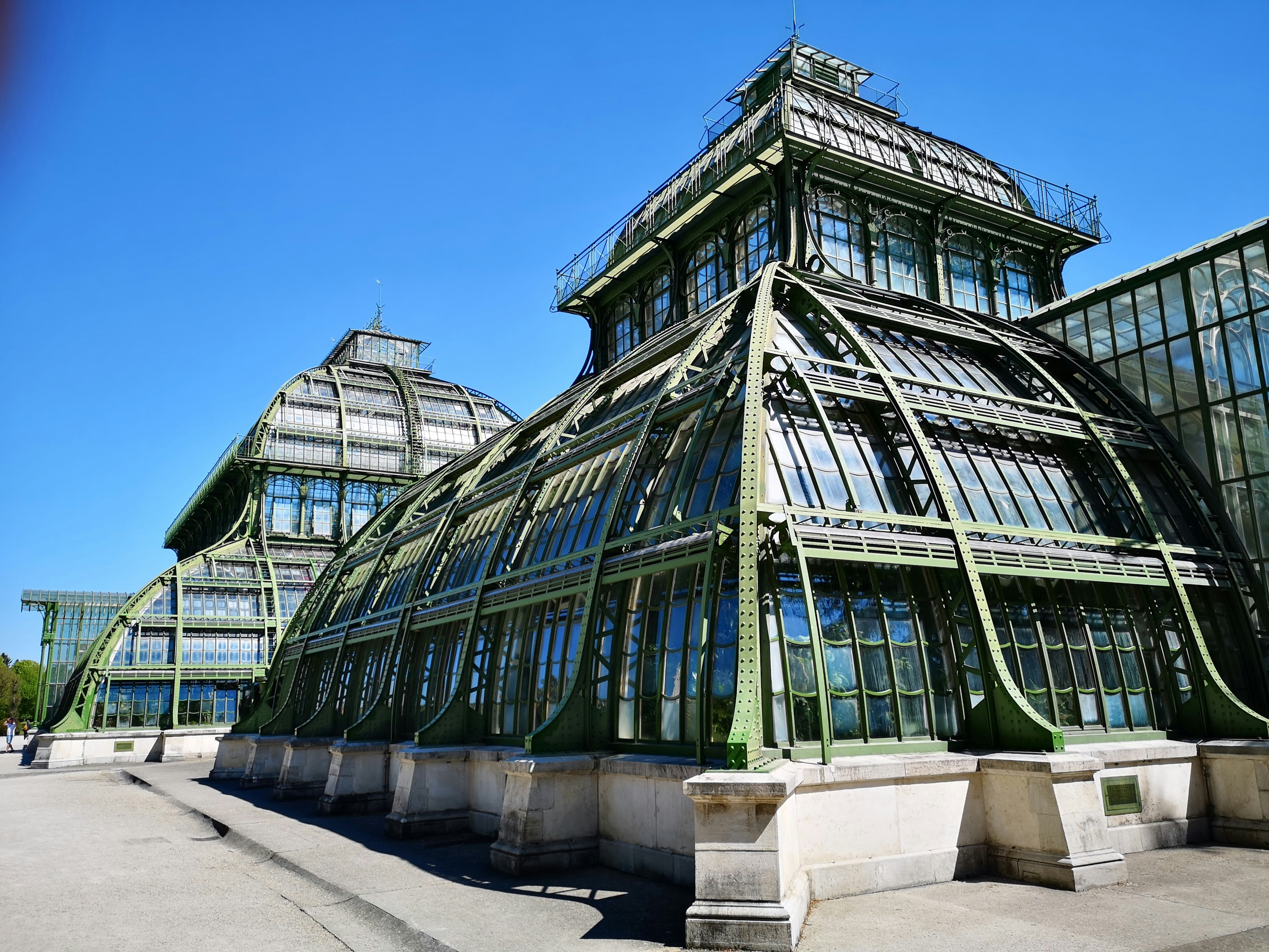 green glass building under blue sky during daytime