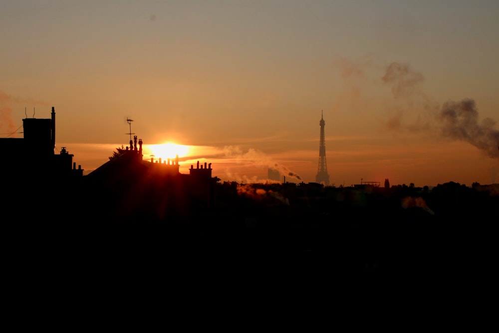 silhouette of city buildings during sunset