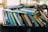 books on brown wooden shelf