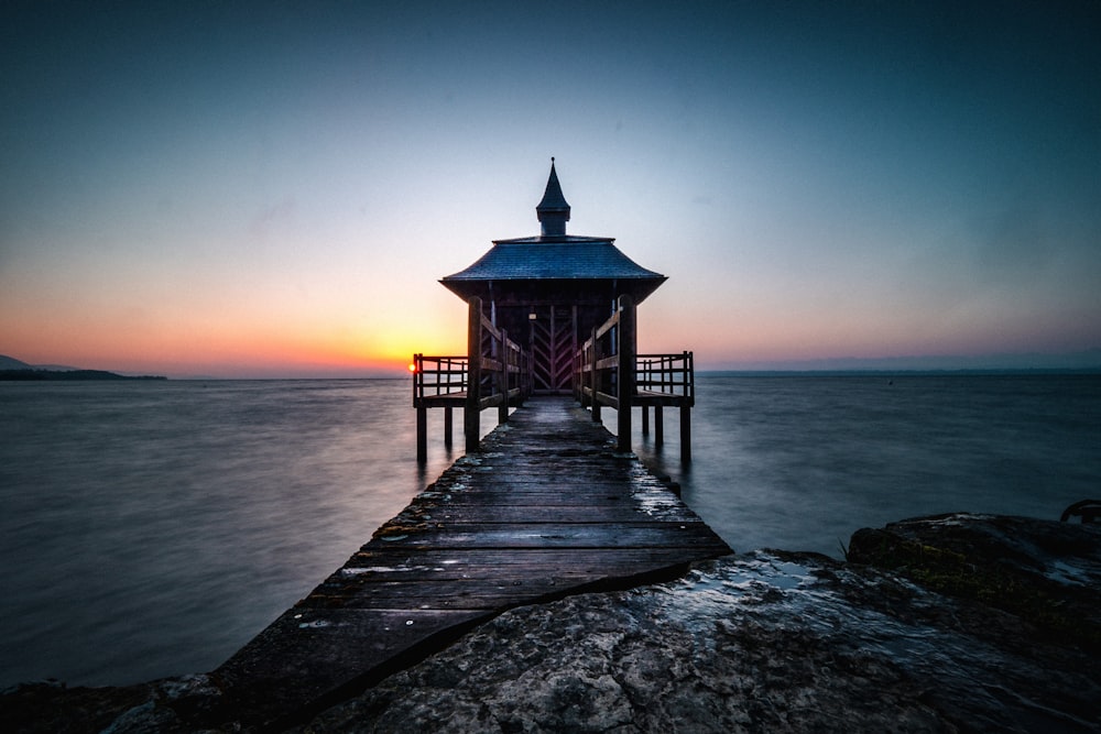 brown wooden dock on sea during daytime