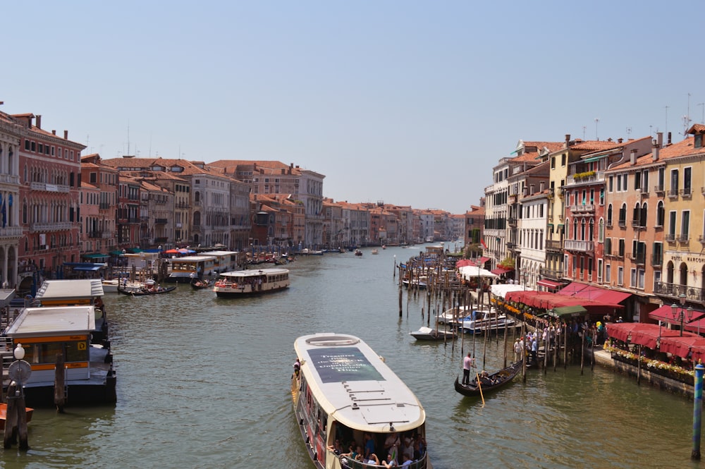 boat on water near buildings during daytime